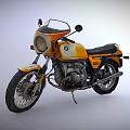 Vintage Orange And White Motorcycle With Round Headlight And Black Seat