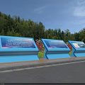 Three Blue Billboards with Green Trees and Red Flowers By Roadside