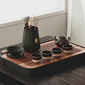 Traditional Tea Set With Black Teapot Small Teacups And Wooden Tray On Table
