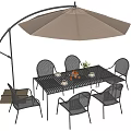 Modern Outdoor Table With Wicker Chairs And Beige Cantilever Umbrella Flower Vase Tableware