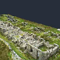 Ancient Stone Ruins Structure With Remnant Walls And Green Grassland