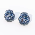 Pair of Blue and White Ceramic Jars with Decorative Lids and Intricate Patterns