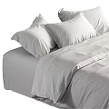 Modern Double Bed with Linen Bedspread and White Pillows in Neutral Toned Bedroom Interior