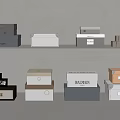 Stylish Storage Boxes In Various Colors And Designs On Display Shelves 3d model