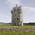 Ancient Stone Tower with Historic Architecture Stone Wall Grassland and Distant Mountains