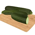 Fresh Green Zucchini on Wooden Cutting Board with Sliced Half