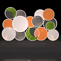 Colorful Circular Objects With Green Moss Textured Surfaces Stacked On Gray Base 3d model