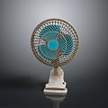 Modern Tabletop Electric Fan With Blue Blades And White Base Metal Grille