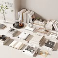 Books And Magazines On Minimalist Modern Desk With Stacked Open Book Teacup Plant And Decorations