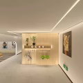 Modern Office Corridor Interior With Wooden Partition Wall Recessed Lighting Plants And Decorative Painting