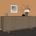 Modern Wooden Entryway Cabinet Sideboard Against Beige Wall With Vase Plant Decor And Wall Art