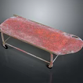 Vintage Stretcher Cart Featuring Red Weathered Surface And Metal Frame With Wheels