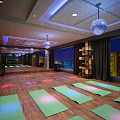 Modern Fitness Studio With Spin Bikes Neon Lights And Disco Ball