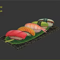 Assorted Fresh Sushi with Tuna Salmon Avocado on Black Slate Plate with Green Leaf
