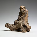 Handcrafted Wooden Sculpture of Seated Old Man on Natural Root Base