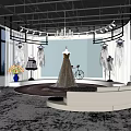 Elegant Bridal Shop Interior With Hanging Wedding Dresses Chandeliers Large Windows Sofa And Rug