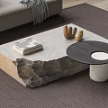 Modern Coffee Table With Rustic Stone Base And Marble Top Featuring Books And Cactus Decor