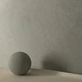 Minimalist Concrete Sphere Component on Flat Surface with Gray Textured Wall