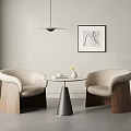Accent Chairs with Cream Upholstery Wooden Legs Round Table Abstract Wall Art and Pendant Light