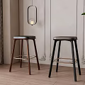 Two Modern Bar Stools With Dark Wood Black Legs And Metal Bars In Minimalist Interior