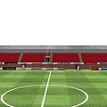 Football Stadium Featuring Green Turf Red Seating Stands White Marking Lines And Floodlight Poles