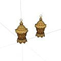 Two Golden Lanterns With Intricate Patterns Top Ring And Decorative Base