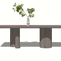 Modern Wooden Dining Table With Cylindrical Legs And White Vase Green Plants
