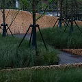 Curved Roadway Structure With Green Landscape And Arch Design In Park Setting