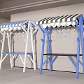 Two Outdoor Swings With Striped Canopies White Blue Frames Against White Wall Light Tiled Floor
