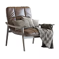 Comfortable Brown Leather Leisure Chair With Soft Pillows And Plaid Blanket