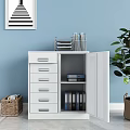 White Bookcase With Drawers And Doors Alongside Woven Baskets Green Plant Light Blue Wall