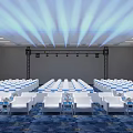 Spacious Conference Hall With Neatly Arranged White Seats Stage Lighting And Blue Patterned Carpet
