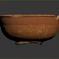Artisanal Carved Terracotta Bowl With Intricate Surface Patterns And Smooth Interior