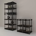 Black Multi Tiered Storage Shelves With Decorative Stones And Minimalist Design