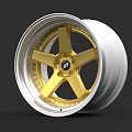 Car Wheel Featuring Silver Rim And Gold Spokes With Center Logo
