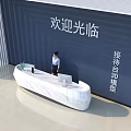 Modern Reception Desk With White Stone Counter And Receptionist In Office Lobby With Welcome Sign