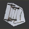 Vintage Wooden Cart With Wheels And Leather Straps On White Cloth Surface