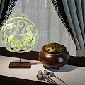 Elegant Decorative Ornament Set with Green Hollow out Ornament Brown Incense Burner and Curtain Background