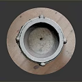 Carved Stone Basin With Square Base And Intricate Carvings On Wooden Platform