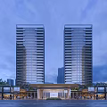 Modern Twin High Rise Residential Buildings With Entrance Landscaping And Evening Sky