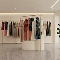 Modern Fashion Clothing Store Interior With Mannequin Display Racks And Marble Counter