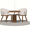 Two Beige Leisure Chairs with Small Round Table Wooden Legs on Light Colored Circular Rug