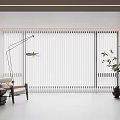 Modern Interior With Vertical Blinds Covering Large Windows Floor Lamp Chair Plant And Storage Cabinets