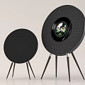 Two Black Round Speakers With Tripod Stands And Display Screen