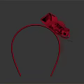 Red Headband With Large Bow And Tulle Decorations On Gray Background