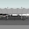 White Canopy Structure Covering Parking Area With Multiple Cars And Support Poles