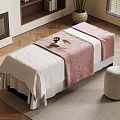 Relaxing Treatment Bed With White And Pink Blanket Stool Carpet Fireplace And Bookshelf