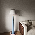 Blue Floor Lamp with White Lampshade Pink Edge and Green Dinosaur Toy on Beige Sofa