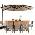 Outdoor Table And Chair Set With Beige Umbrella Wicker Chairs Decorative Vase And Fruit Bowl