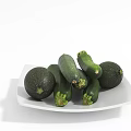 Fresh Green Organic Zucchini Placed on White Ceramic Plate in Bright Kitchen